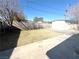 Spacious backyard with grass, trees, and fencing, perfect for outdoor entertaining and relaxation at 619 Brush St, Las Vegas, NV 89107