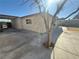 Backyard concrete patio and stucco facade, providing ample space for outdoor activities and relaxation at 619 Brush St, Las Vegas, NV 89107