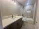 Updated bathroom features a shower and tub, vanity with counter, and new light fixture at 619 Brush St, Las Vegas, NV 89107