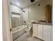 Bathroom features new white cabinets, tub and shower, and neutral gray walls at 619 Brush St, Las Vegas, NV 89107