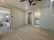 Renovated bedroom showcasing new flooring, paint, and a convenient ensuite bathroom at 619 Brush St, Las Vegas, NV 89107