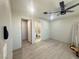 Spacious bedroom features new ceiling fan, light grey walls, and wood-look flooring at 619 Brush St, Las Vegas, NV 89107