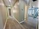 Hallway showcasing updated flooring, neutral paint, and seamless transitions to multiple rooms at 619 Brush St, Las Vegas, NV 89107