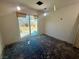 Bright living room with sliding glass doors leading to a backyard view; blank space awaiting personalization at 619 Brush St, Las Vegas, NV 89107