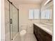 Stylish bathroom, featuring a double vanity and a walk-in shower at 6402 Agua Dr, Las Vegas, NV 89103