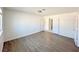 Bright bedroom with wood-look floors and neutral walls at 6402 Agua Dr, Las Vegas, NV 89103