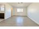 Bright bedroom with wood-look flooring and ensuite bathroom at 6402 Agua Dr, Las Vegas, NV 89103