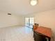 Dining area with tile floor, wooden table and patio access at 6402 Agua Dr, Las Vegas, NV 89103