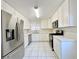 Modern kitchen with white cabinets and stainless steel appliances at 6402 Agua Dr, Las Vegas, NV 89103