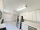 Kitchen with stainless steel appliances and white cabinets at 6402 Agua Dr, Las Vegas, NV 89103