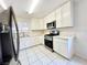 Updated kitchen, featuring stainless steel appliances and white cabinets at 6402 Agua Dr, Las Vegas, NV 89103