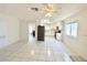 Kitchen with white cabinets and view of living room at 6402 Agua Dr, Las Vegas, NV 89103