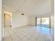 Spacious living room with tile floors and access to backyard at 6402 Agua Dr, Las Vegas, NV 89103