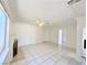 Spacious living room featuring tile floors and a fireplace at 6402 Agua Dr, Las Vegas, NV 89103