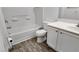 Modern bathroom featuring white vanity and tiled bath at 7453 Vital Ct, Las Vegas, NV 89149