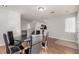 Dining room with a round table and six black chairs at 7453 Vital Ct, Las Vegas, NV 89149