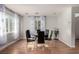 Dining room with round table, six chairs, and wood floors at 7453 Vital Ct, Las Vegas, NV 89149