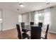 Dining area with a round table and six black chairs at 7453 Vital Ct, Las Vegas, NV 89149