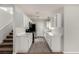 Modern kitchen featuring white cabinets, stainless steel appliances, and grey flooring at 7453 Vital Ct, Las Vegas, NV 89149