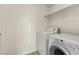 Laundry area featuring a white washer and dryer at 7453 Vital Ct, Las Vegas, NV 89149