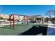 Play area with swings and grassy area at 7453 Vital Ct, Las Vegas, NV 89149