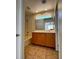 Clean bathroom with a shower/tub combo and wood vanity at 938 Cantabria Heights Ave, Las Vegas, NV 89183