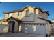 Two-story house with attached garage and neutral color scheme at 938 Cantabria Heights Ave, Las Vegas, NV 89183