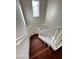 Elegant wooden staircase with white railings leading to the upper level at 938 Cantabria Heights Ave, Las Vegas, NV 89183