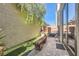 Small grassy backyard with patio and bench at 939 Paisley St, Las Vegas, NV 89145