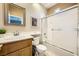 Well-lit bathroom with shower/tub combo and wood vanity at 939 Paisley St, Las Vegas, NV 89145