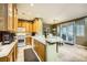 Well-equipped kitchen with light wood cabinets and a breakfast bar at 939 Paisley St, Las Vegas, NV 89145