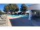 Large community pool with multiple areas and lounge chairs at 939 Paisley St, Las Vegas, NV 89145