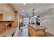 Kitchen with granite island, light wood cabinets, and stainless steel appliances at , Las Vegas, NV 89123