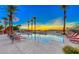 Inviting community pool with lounge chairs and sunset views at , Las Vegas, NV 89123