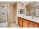 Double vanity bathroom with a shower and tub at 10161 Kermode Ct, Las Vegas, NV 89178