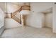 Two story dining room with tile flooring and wooden staircase at 10161 Kermode Ct, Las Vegas, NV 89178