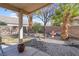 Landscaped backyard with mature trees and rock garden at 1020 Blue Lantern Dr, Henderson, NV 89015