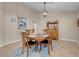 Bright dining area with a wood table and chairs, and decorative sideboard at 1020 Blue Lantern Dr, Henderson, NV 89015