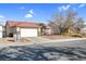 Single story home with a two car garage and landscaped yard at 1020 Blue Lantern Dr, Henderson, NV 89015