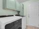 Bright laundry room, featuring washer, dryer, and ample storage at 1020 Blue Lantern Dr, Henderson, NV 89015