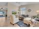 Comfortable living room with vaulted ceiling and neutral decor at 1020 Blue Lantern Dr, Henderson, NV 89015