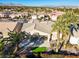 Aerial view of house, landscape, and golf course at 10247 Santo Nina Ct, Las Vegas, NV 89135