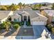 Single story home with a two-car garage and desert landscaping at 10247 Santo Nina Ct, Las Vegas, NV 89135