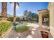 Landscaped backyard with gravel, bushes, and a bird bath at 10247 Santo Nina Ct, Las Vegas, NV 89135