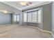 Bedroom with mirrored closet and bay window at 10247 Santo Nina Ct, Las Vegas, NV 89135