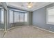 Bedroom with bay window, plantation shutters, and ceiling fan at 10247 Santo Nina Ct, Las Vegas, NV 89135