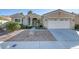 One-story house with a two-car garage and landscaped front yard at 10247 Santo Nina Ct, Las Vegas, NV 89135