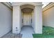 Front entry with double doors and arched entryway at 10247 Santo Nina Ct, Las Vegas, NV 89135