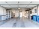 Organized garage with overhead storage and extra shelving at 10247 Santo Nina Ct, Las Vegas, NV 89135