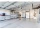 Spacious garage with overhead storage and built-in cabinets at 10247 Santo Nina Ct, Las Vegas, NV 89135